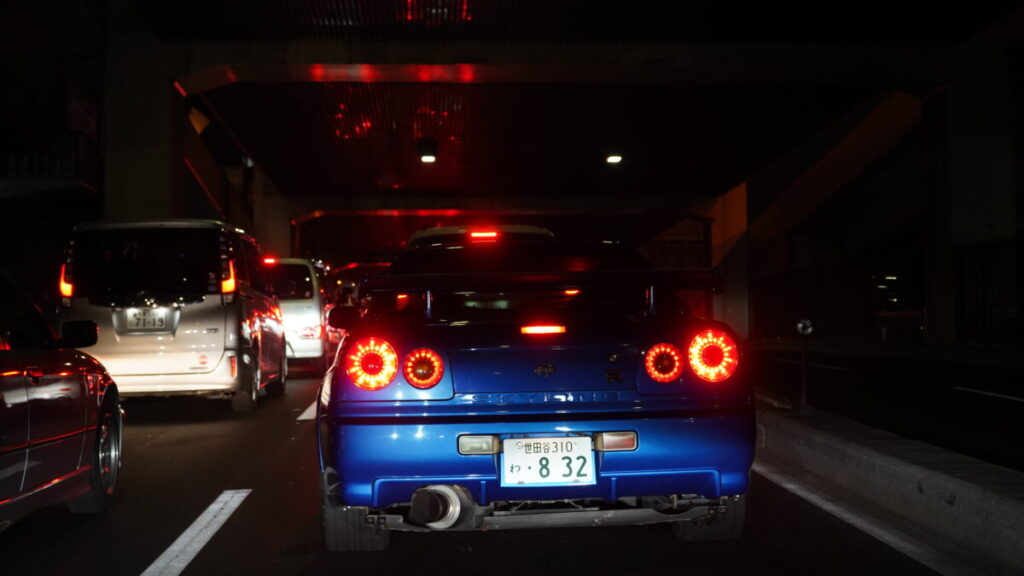 NISSAN GT-R R34 V-Spec on highway in Tokyo